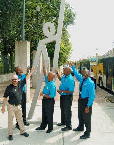 Douglas Kornfeld does the EvacuSpot pose with New Orleans Regional Transit Authority bus drivers
