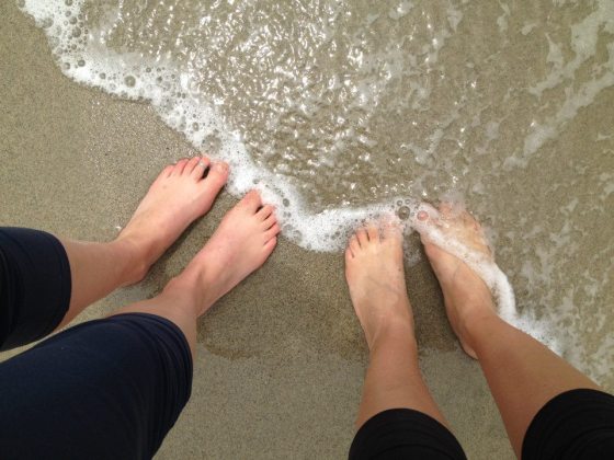 Dipping our toes in the Pacific Ocean for the first time, near Los Osos, CA.