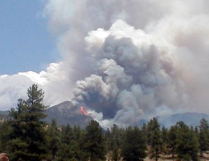 The 2002 Hayman Fire burning in the distance. Source: Teller County
