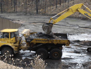 Denver Water mucking out the debris and sediment after a flood. Source: Denver Water, Don Kennedy