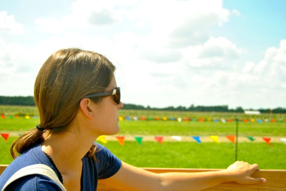Allie contemplates the whether corn will always be king while taking a tractor ride at the Antique Tractor and Homestead Craft Show in Belmond, Iowa